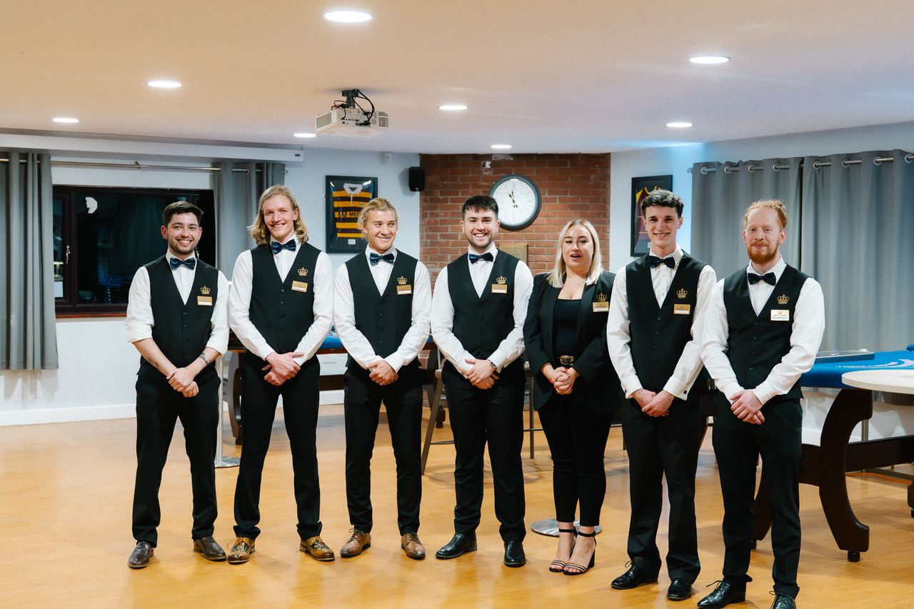 The Royale Casino Hire croupier team lined up in uniform