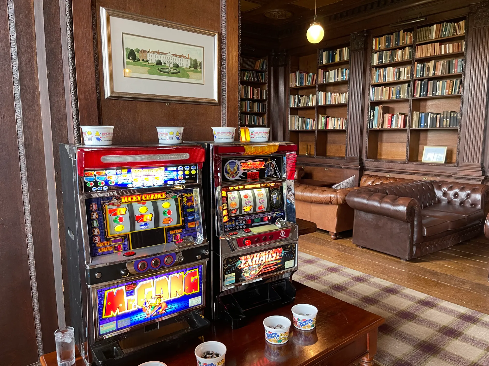 Two Royale slot machines set up in a wood-panelled venue library