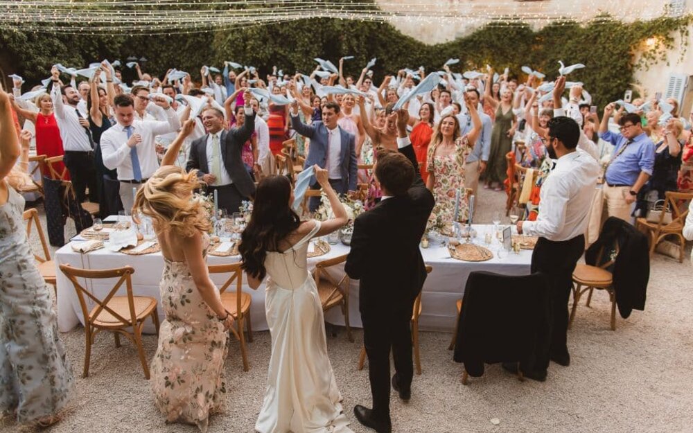 Wedding guests celebrating at a destination reception, photographed by The Springles